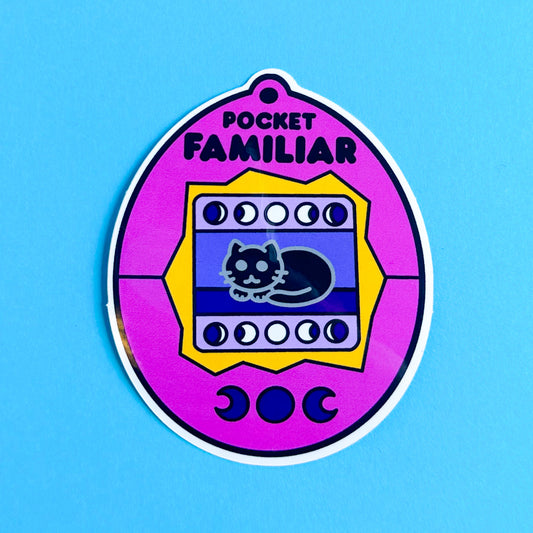 A sticker of a pink virtual pet of a cat. The sticker is on a blue background.