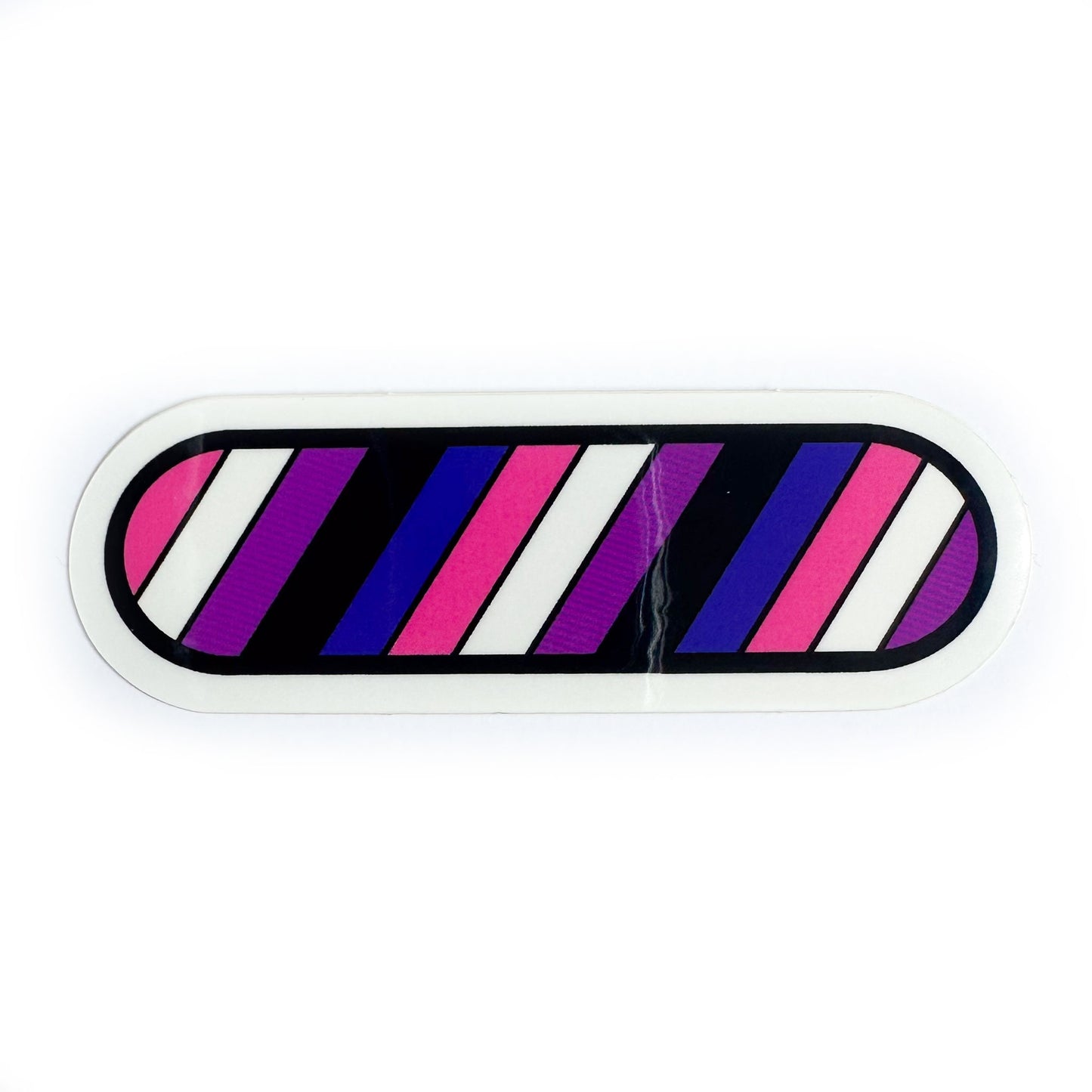 A sticker in the colors of the Gender Fluid Pride Flag, it's the shape of a capsule with diagonal stripes of pink, white, purple, black and blue. 