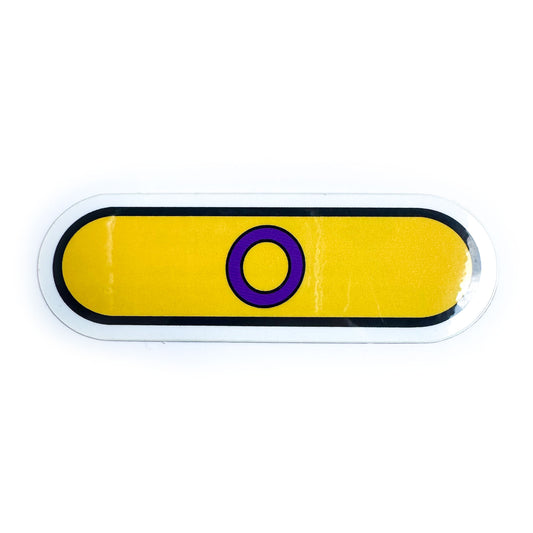 A vinyl sticker shaped like a capsule in the colors and motif of the Intersex Pride Flag. It has a yellow background with a purple circle on it.