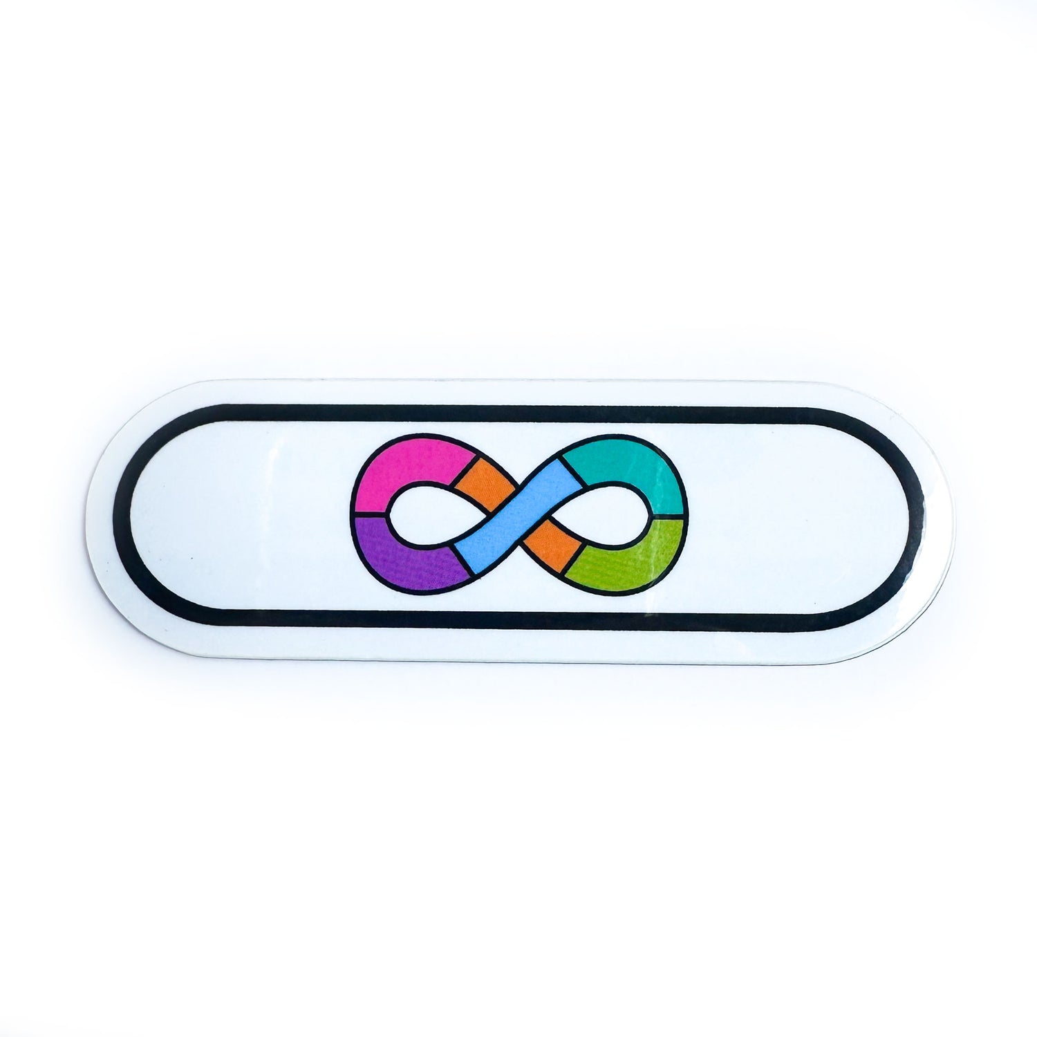 A capsule shaped sticker with the rainbow infinity symbol of the Neurodivergent Pride flag on it. 