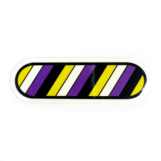 A vinyl sticker in the shape of a capsule with the colors of the Nonbinary Pride flag.