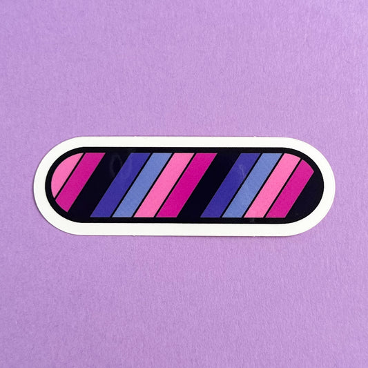A vinyl sticker in the shape of an oval with diagonal stripes of the Omni Pride Flag. The stick is on a purple background.