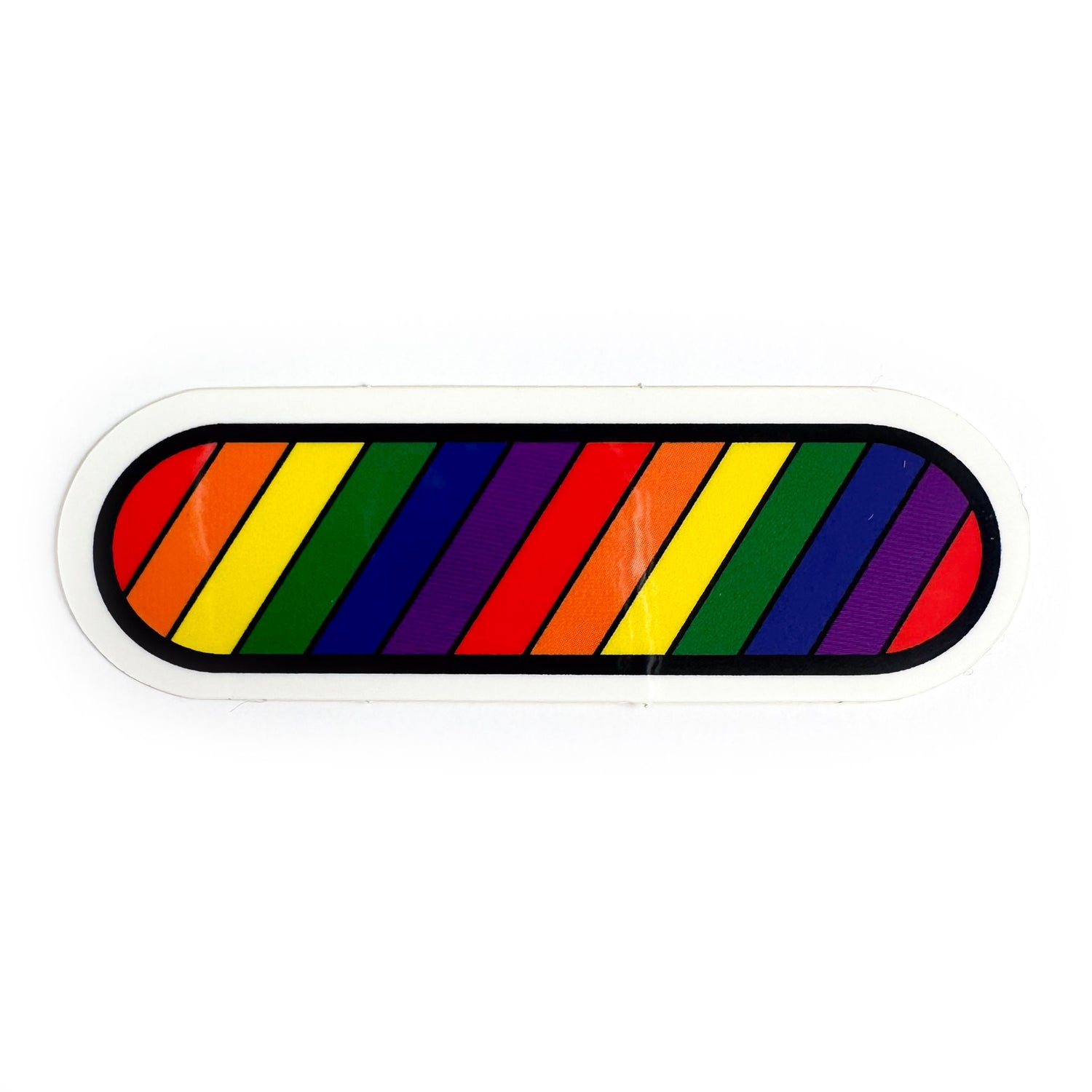 A capsule shaped vinyl sticker with diagonal rainbow stripes across it.