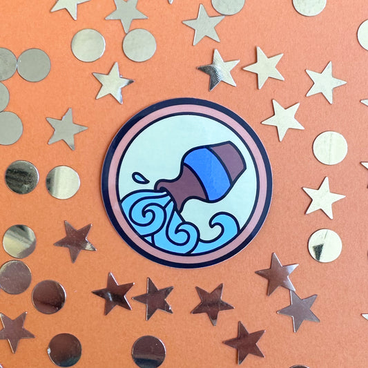 A sticker of the Aquarius symbol of the water bearer on an orange background surrounded by gold stars and stickers