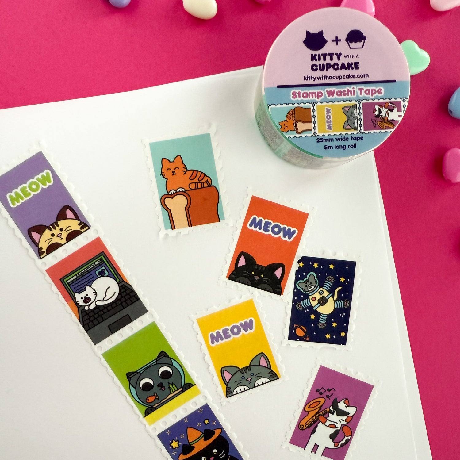 A roll of cat themed stamp washi tape. There is a packaged roll of tape with the Kitty With a Cupcake logo and an example of the tape inside. Below that is a displayed section of the tape, which is sectioned into stamp-style squares.