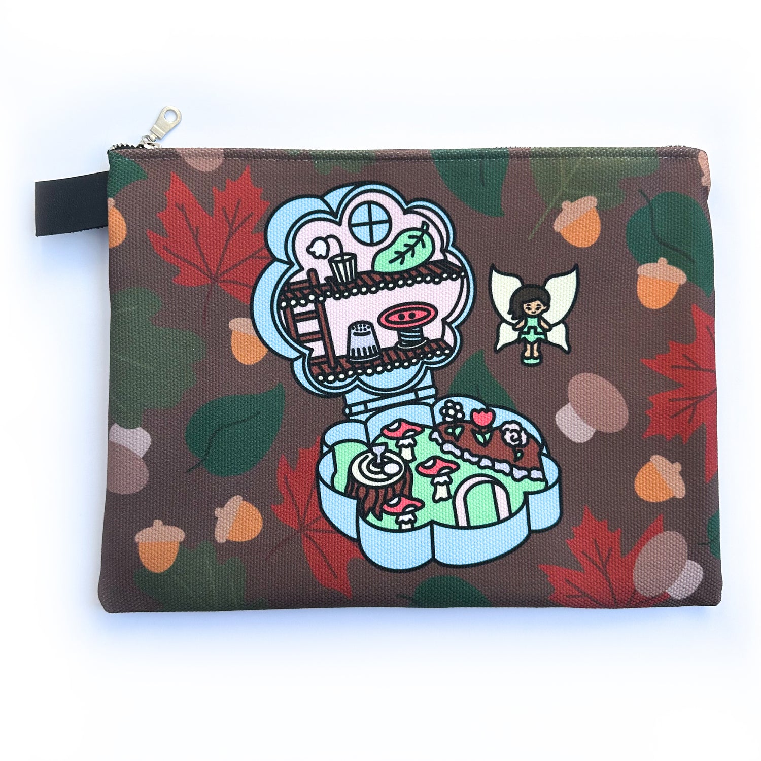 A flat zipper bag with an illustration of a fairy polly pocket compact on it with a background of fall leaves and acorns.