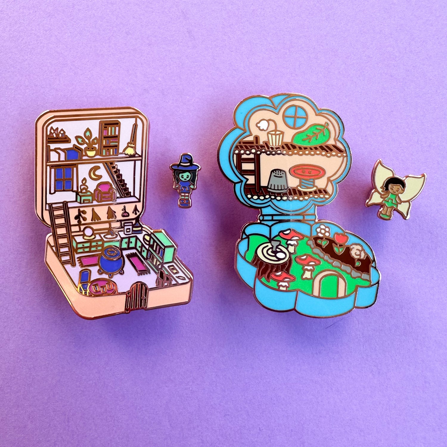 The Witchy Pocket Pin set next to the fairy Pocket Pin Set. 