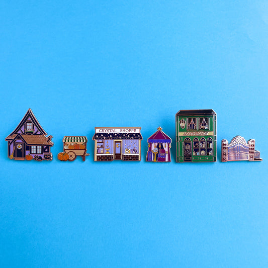 The full magical town square pin set displayed on a blue background