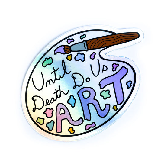 A holographic sticker shaped like an artist's palette with a paint brush that reads "until death do us art".