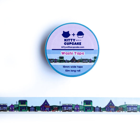A blue washi tape with an illustration of a magically themed town street
